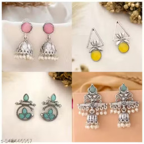 A stylish trio of oxidized silver earrings, comprising a classic jhumki and two contemporary designer pieces. This ensemble effortlessly blends traditional charm with modern elegance for a versatile and chic appeal.